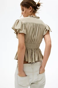 Blouse à manches volantées avec basque