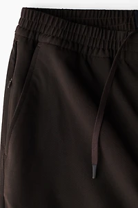 Pantalon large à taille élastique quatre sens
