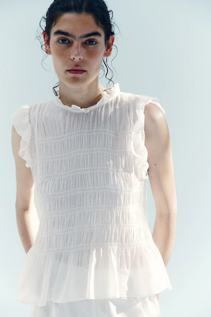 Haut péplum smocké