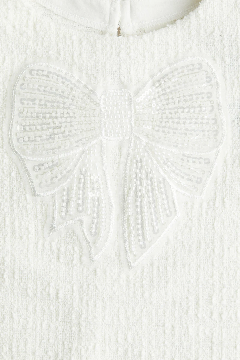 Robe en tissu bouclé