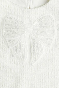 Robe en tissu bouclé