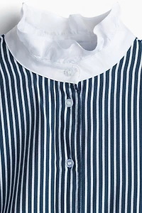 Blouse à col volanté