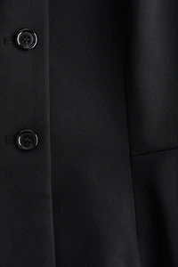 Chandail sans manches avec encolure en V et basque