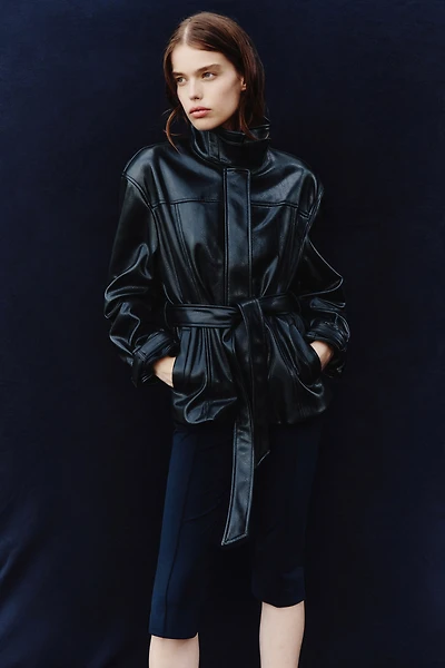 Veste à col droit en tissu enduit