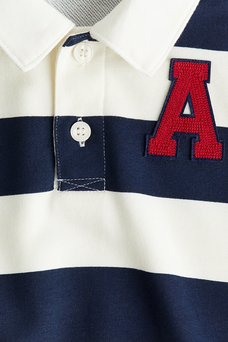 Polo de rugby avec appliqué
