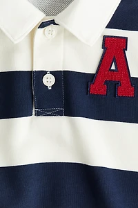 Polo de rugby avec appliqué