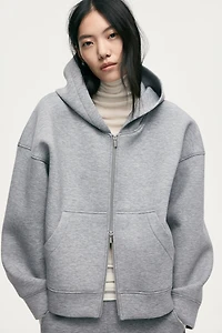 Veste à capuche et fermeture éclair en scuba