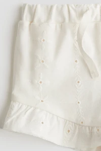 Short en jersey avec broderie anglaise