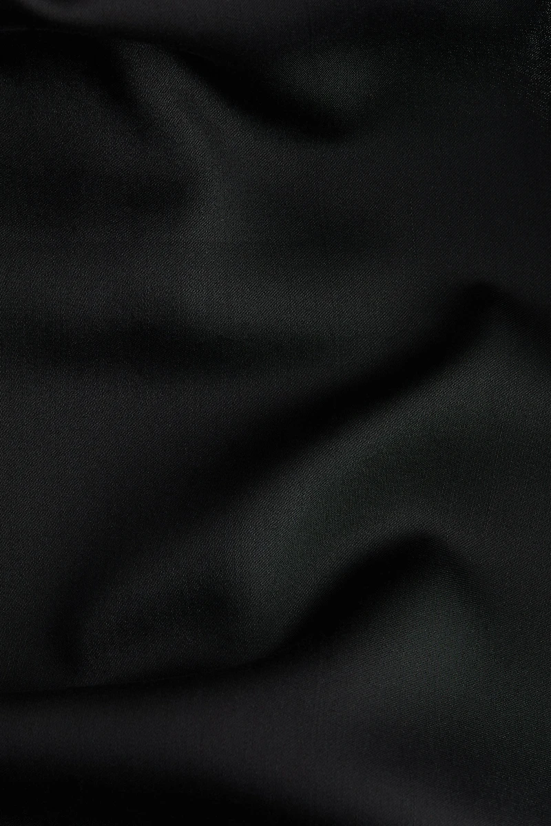 Haut asymétrique à dos nu