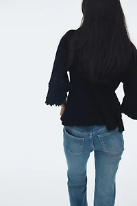 Chandail à volant en tricot pointelle