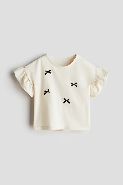 Haut en coton avec appliqués
