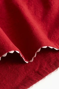 Lot de 2 serviettes table à bords festonnés