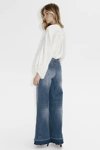 Jean taille haute avec jambes larges