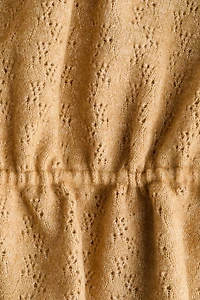 Haut péplum en tricot pointelle