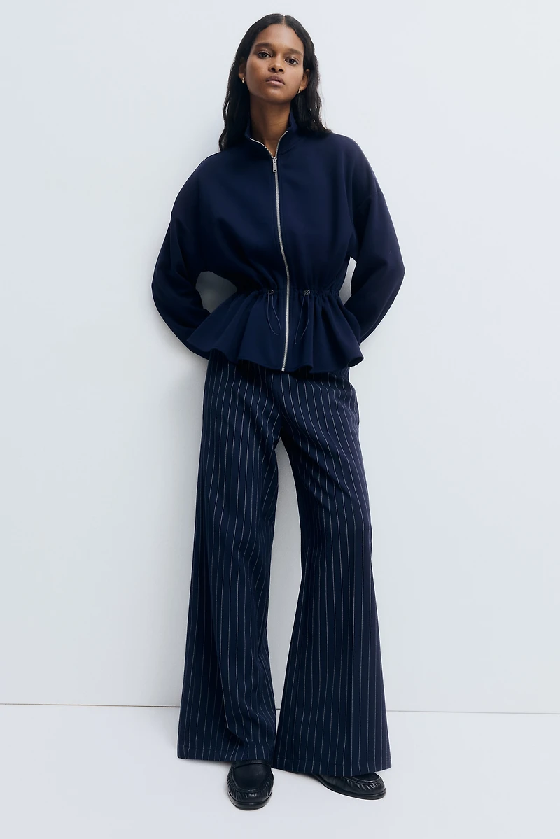 Chandail péplum à fermeture éclair