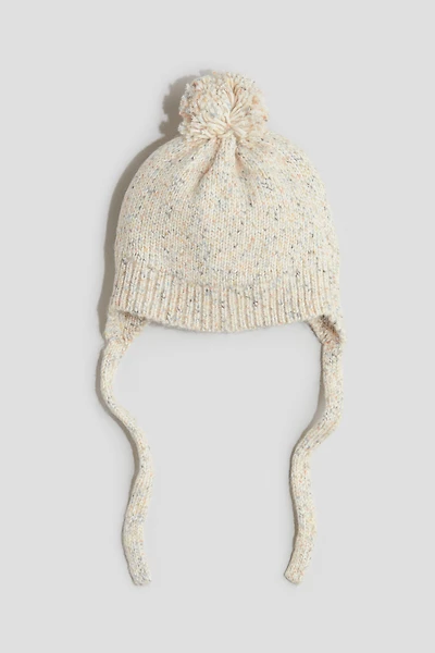 Bonnet en tricot avec rabats d'oreilles