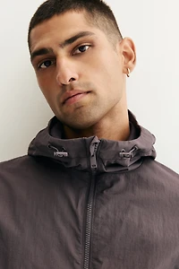 Veste coupe-vent à capuche