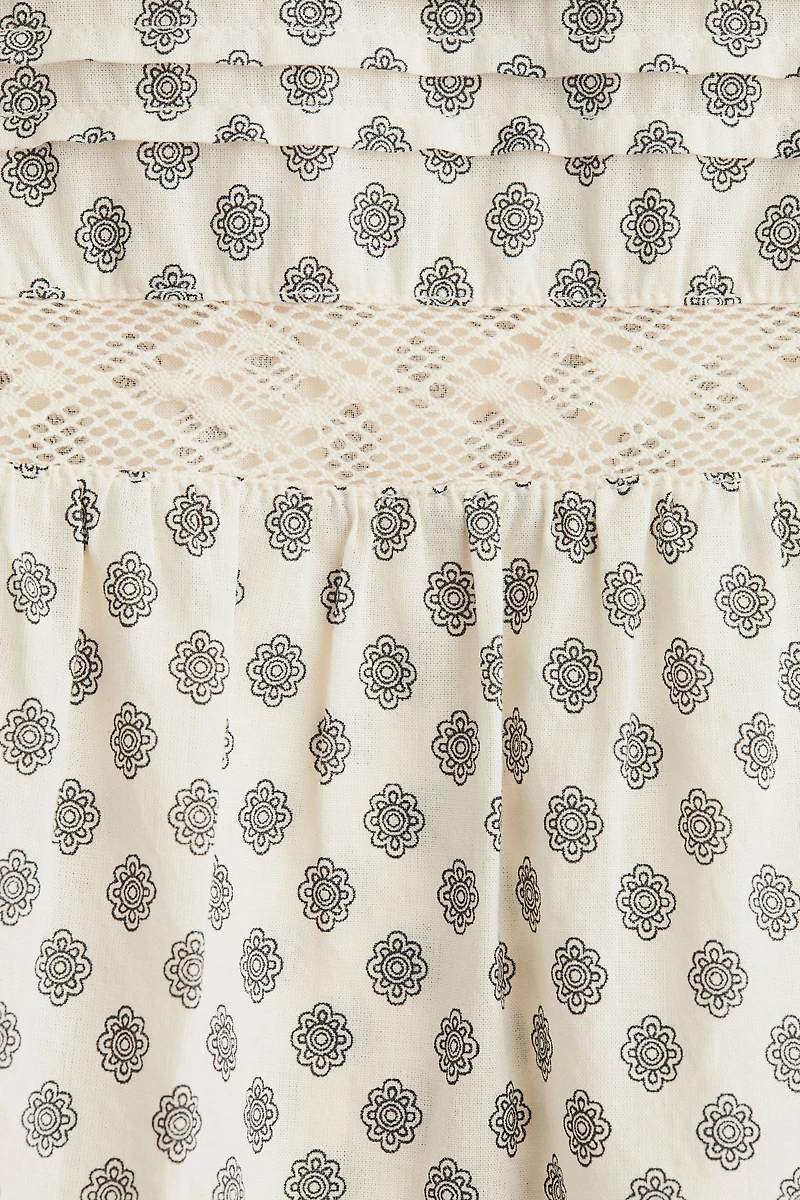 Blouse péplum avec dentelle