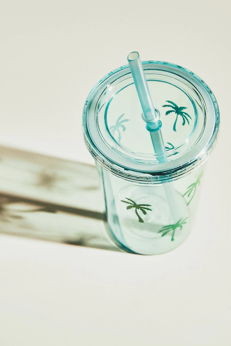Gobelet en plastique à motif avec paille