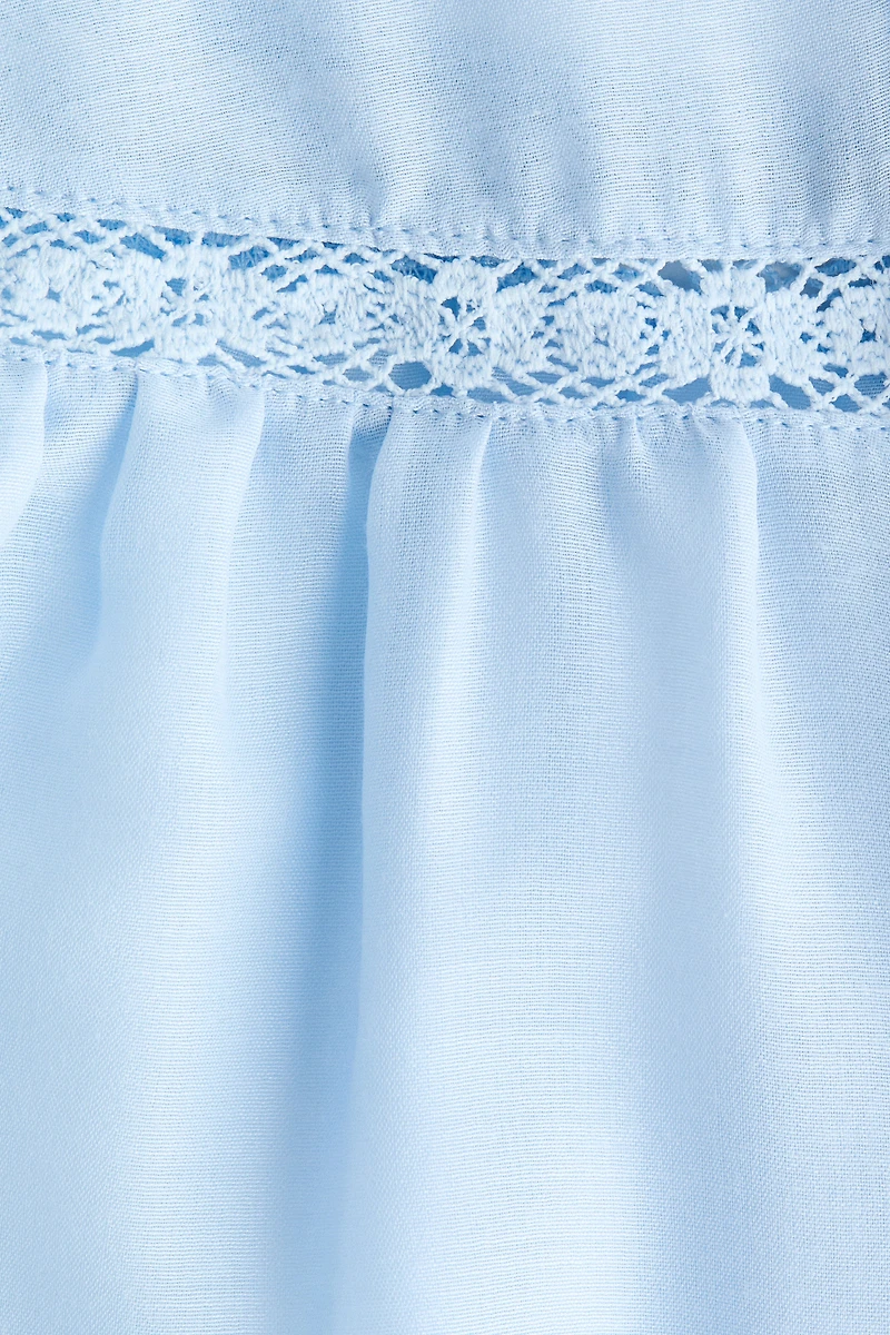 Blouse à volants avec manches ballon