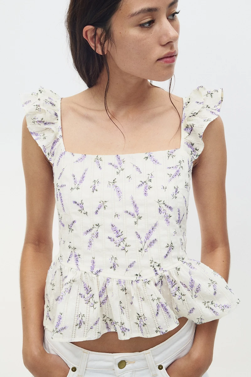 Blouse péplum avec détail à nouer