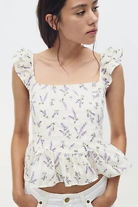 Blouse péplum avec détail à nouer