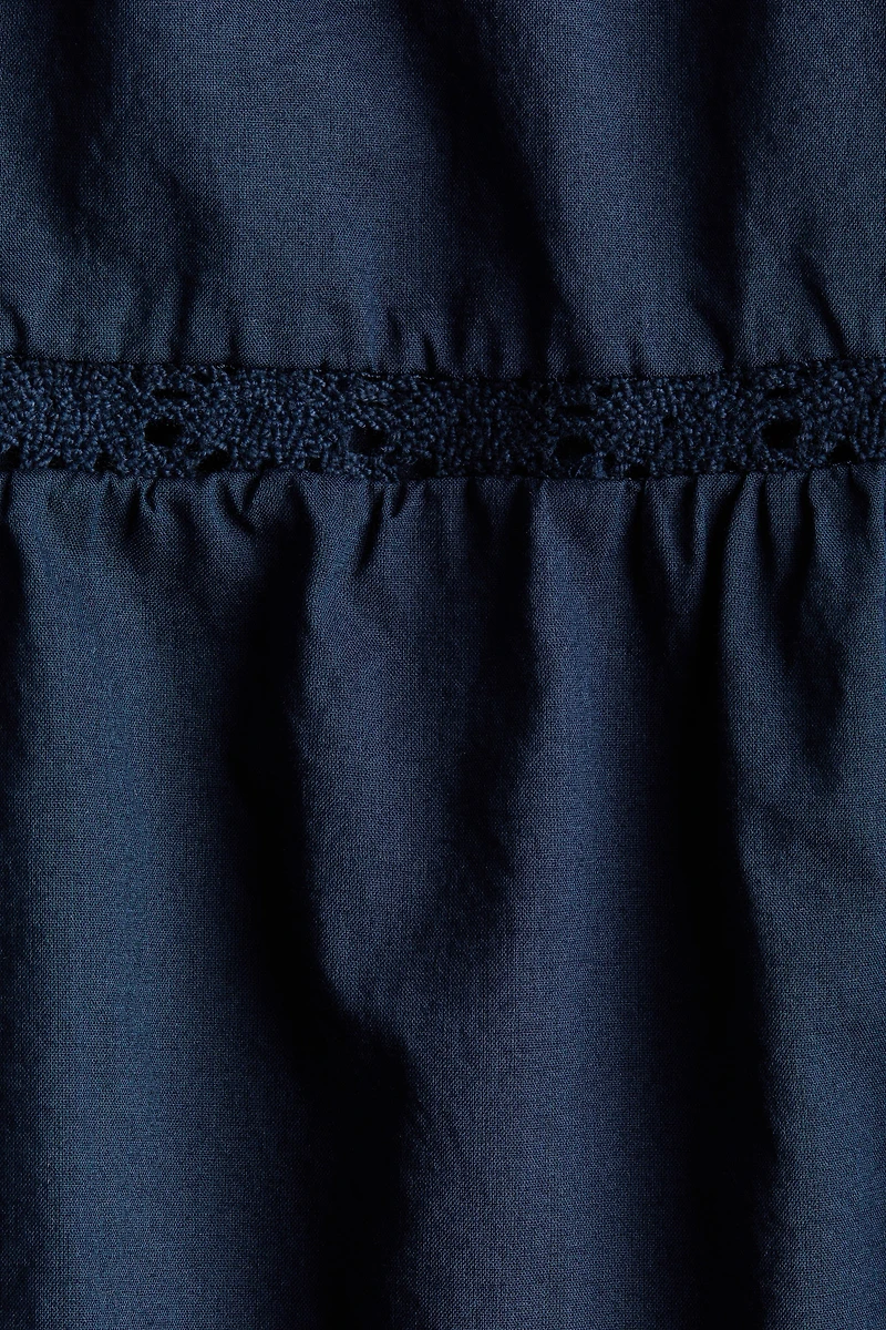 Lace-Trimmed Dress with Flared Skirt