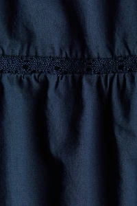 Lace-Trimmed Dress with Flared Skirt