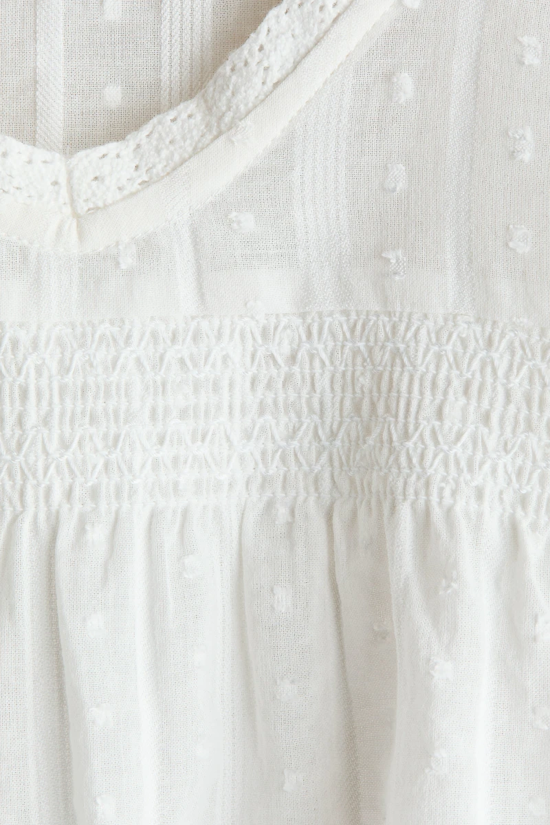 Blouse à manches volantées