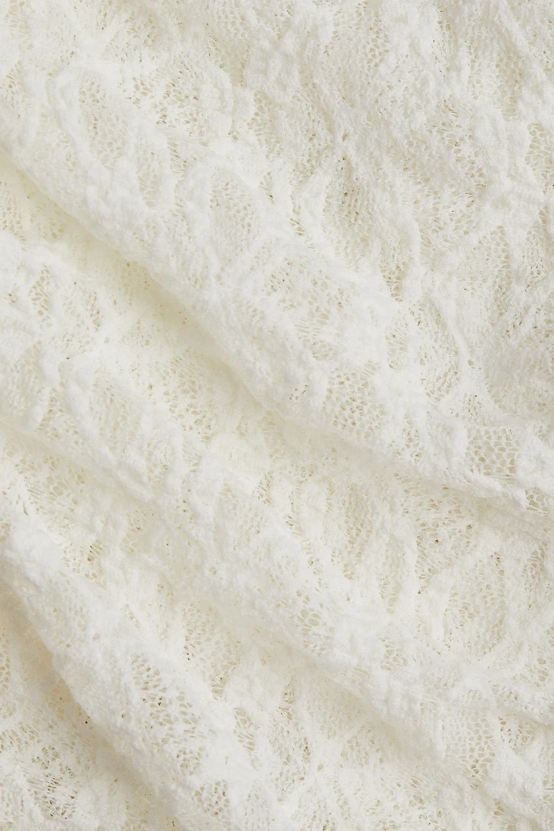 Pantalon en dentelle avec jupe superposée