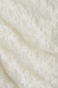 Pantalon en dentelle avec jupe superposée