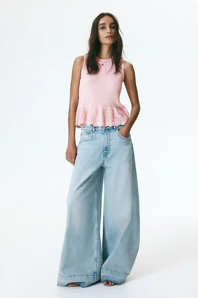 Haut péplum en tricot pointelle