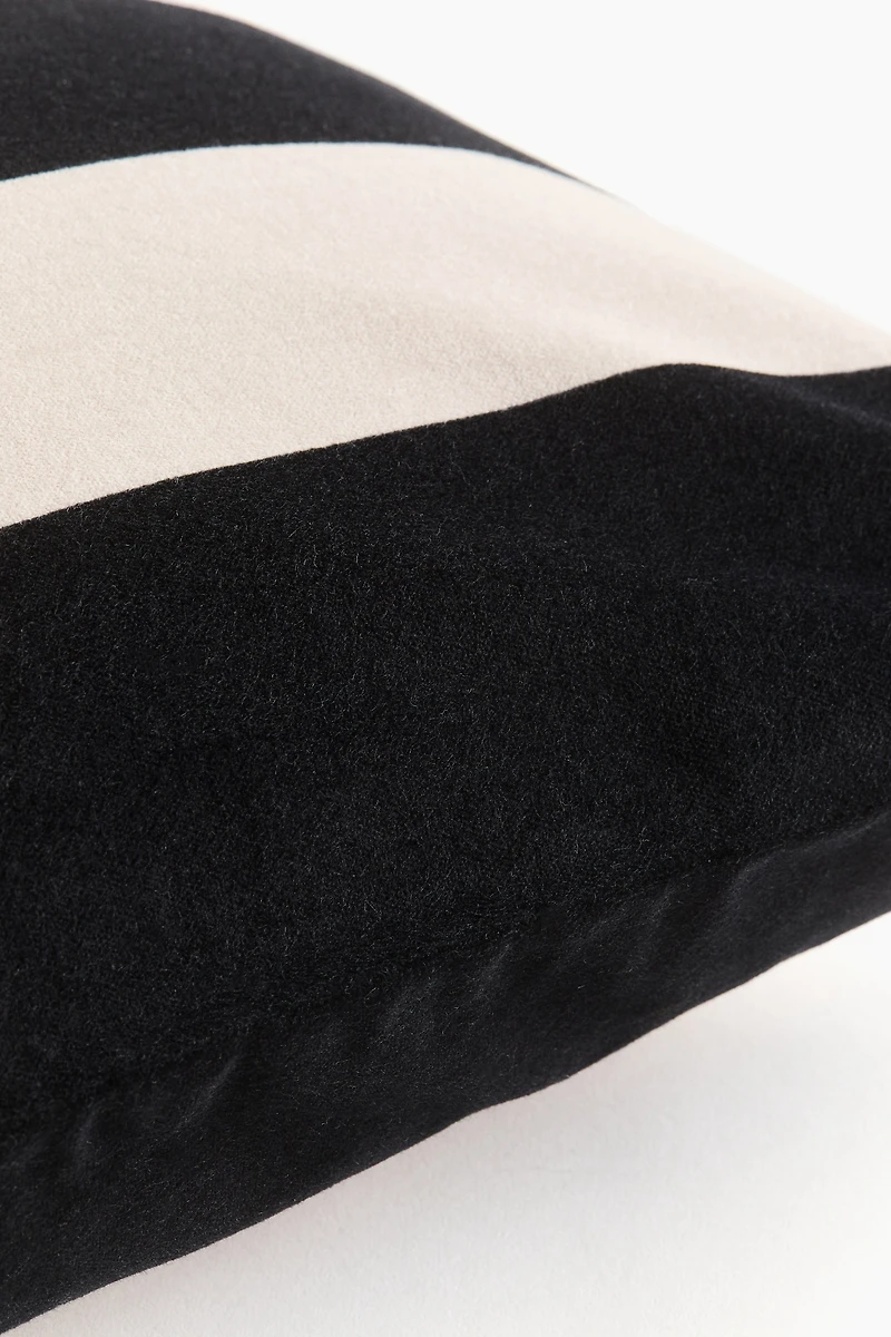 Housse de coussin rayée en velours