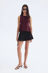 Interlock Sleeveless Peplum Top