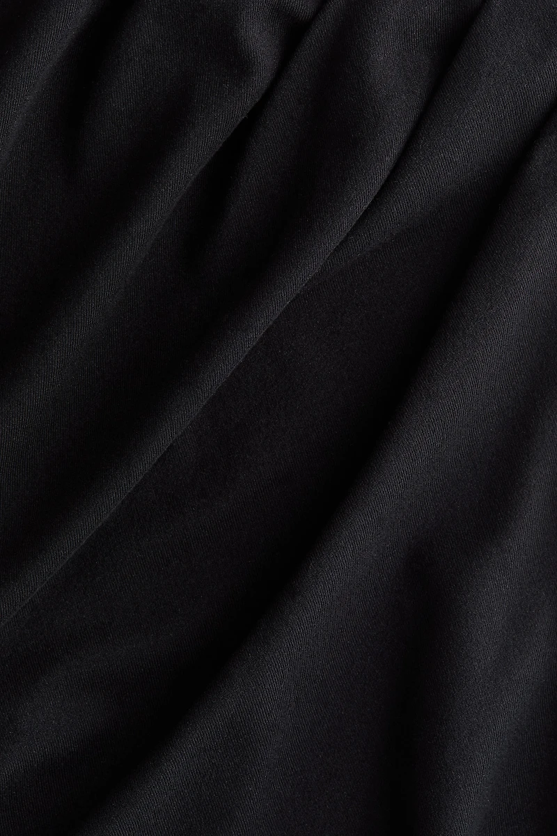 Draped Asymmetric Top