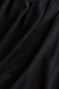 Draped Asymmetric Top