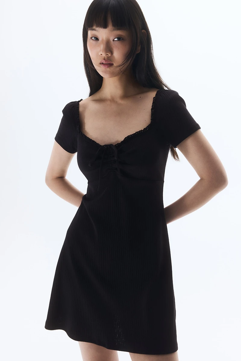 Lace-Trimmed Dress with Flared Skirt