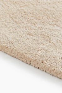 Grand tapis asymétrique