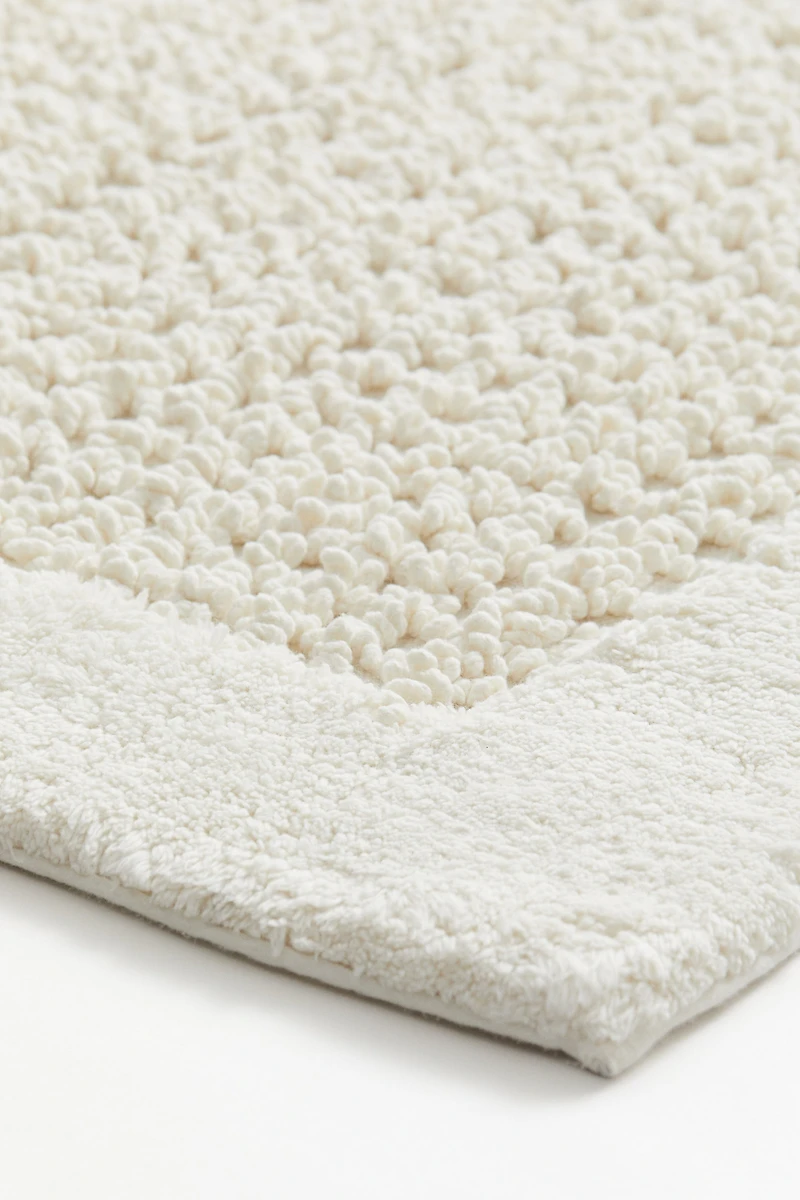 Tapis de bain en coton touffeté