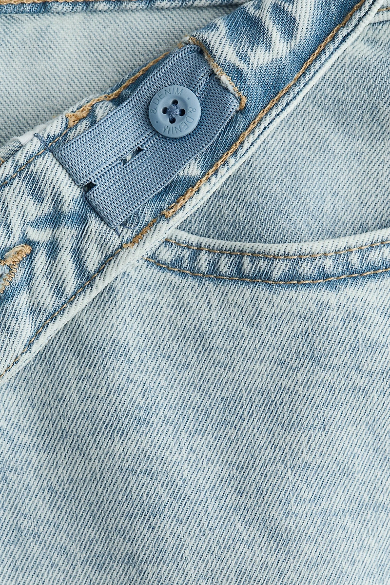 Short taille basse en denim aux jambes larges