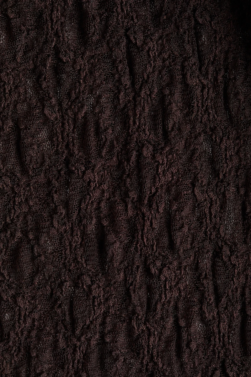 Pantalon en dentelle avec jupe superposée