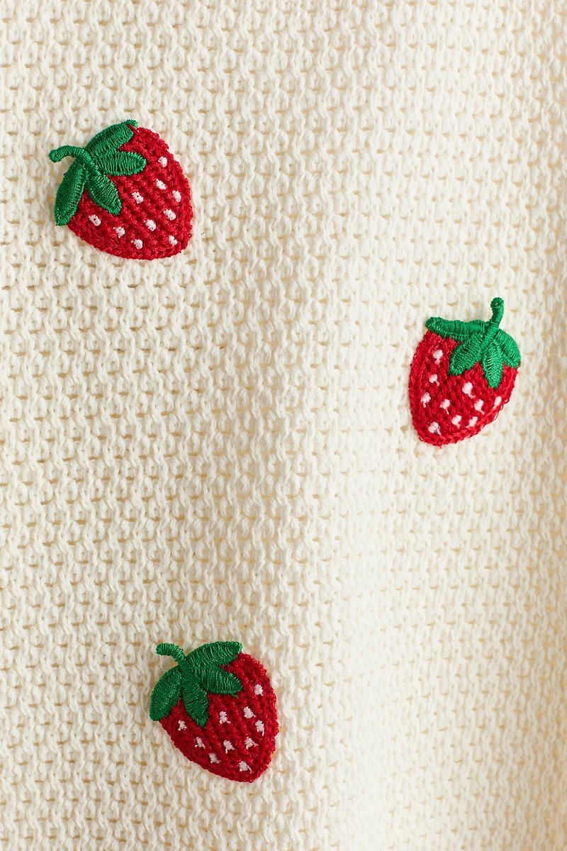 Robe en tricot ajouré avec appliqués