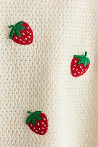 Robe en tricot ajouré avec appliqués