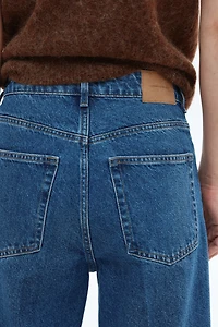 Jean large en haut de la cheville