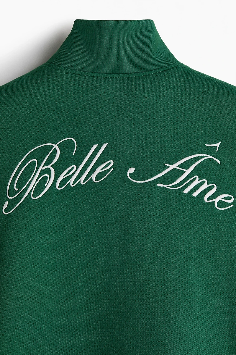 Chandail col à fermeture éclair et motifs