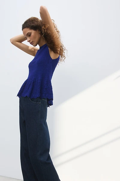Haut péplum en tricot pointelle