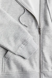 Veste à capuchon glissière