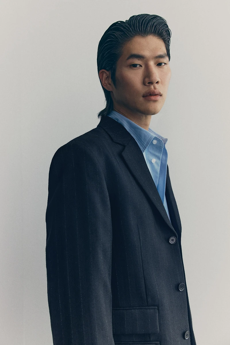 Longue veste à fermeture droite en laine