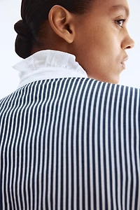 Blouse à col volanté