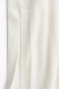 Robe de plage en tricot pointelle